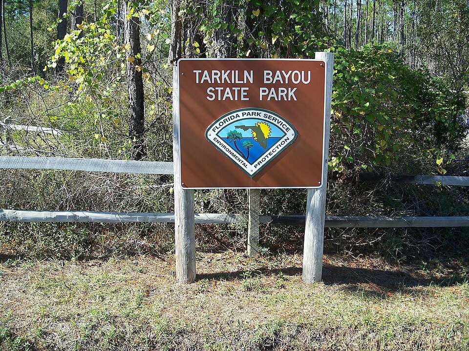 Sign of Tarkiln Bayou Preserve State Park / Wikipedia / Ebyabe https://en.wikipedia.org/wiki/Tarkiln_Bayou_Preserve_State_Park#/media/File:Pensacola_FL_Tarkiln_Bayou_SP_sign01.jpg
