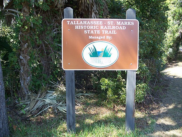 Tallahassee-St. Marks Historic Railroad State Trail / Wikimedia Commons / Ebyabe
Link: https://commons.wikimedia.org/wiki/File:St_Marks_FL_RR_trail_sign01.jpg
