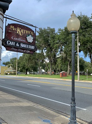 Street sign of Miz Kathi's Cotillion Southern Café / Flickr / Dr. Mike Caudle 
Link: https://flic.kr/p/2jLtbox 
